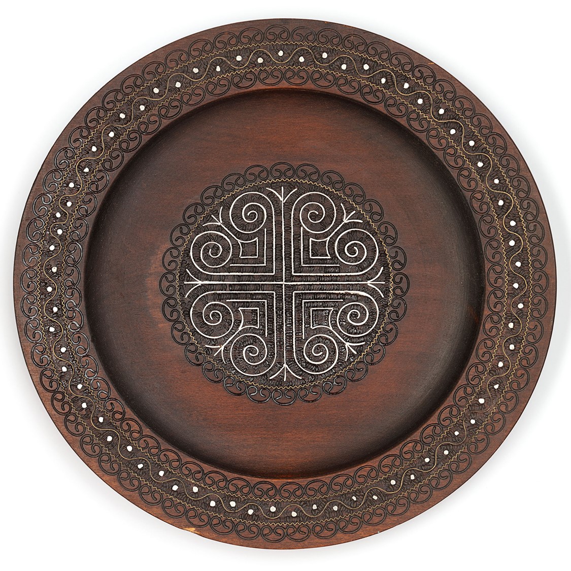 image of an ornamental plate in wood, with metal inlay