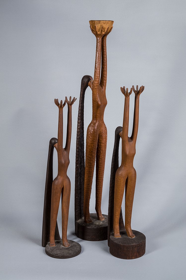 image of 3 sculptures entitled Towards the Sun II showing 3 females raising their arms towards the Sun - wooden replica of an earlier sculpture made in plaster