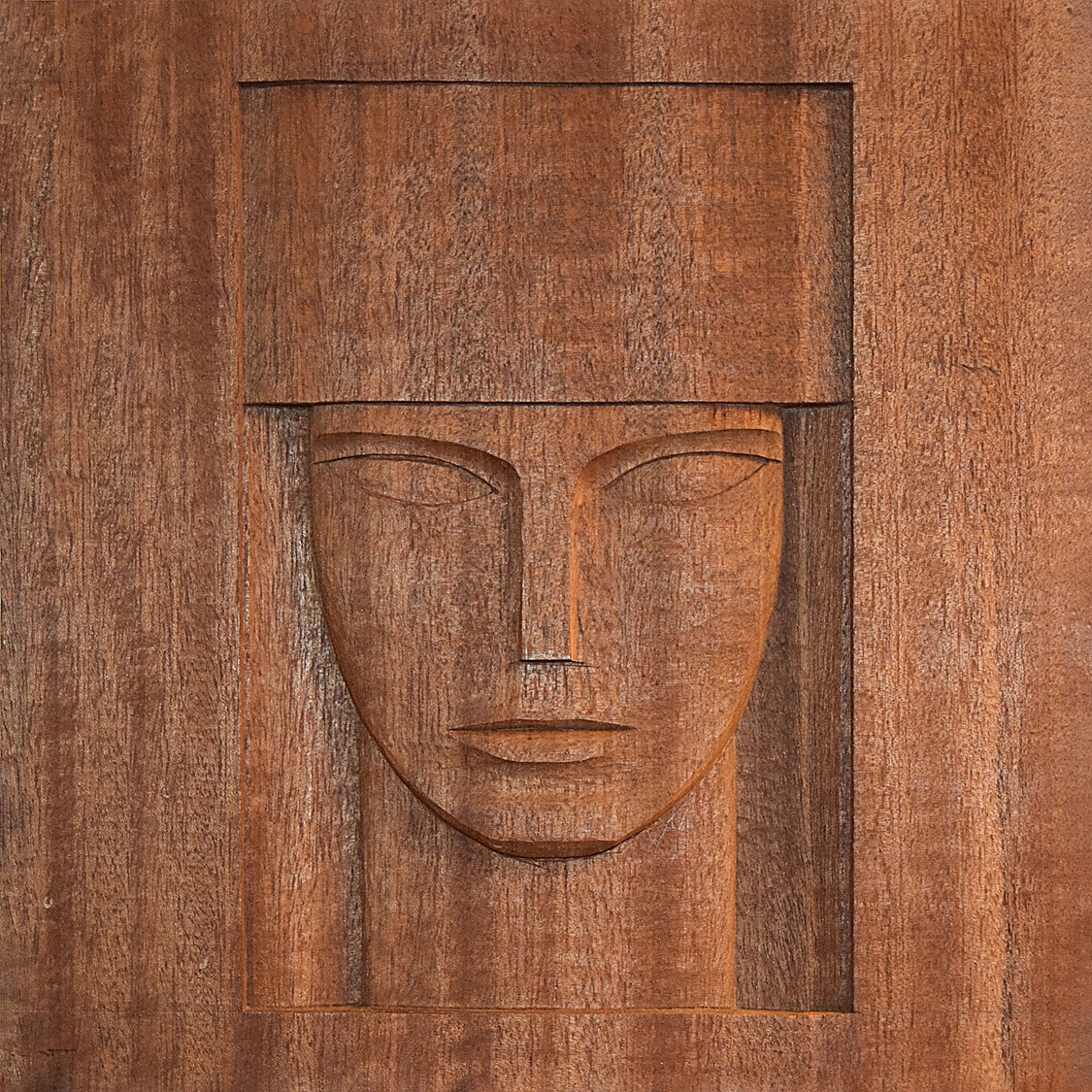 image of a carving in wood representing the head of a queen